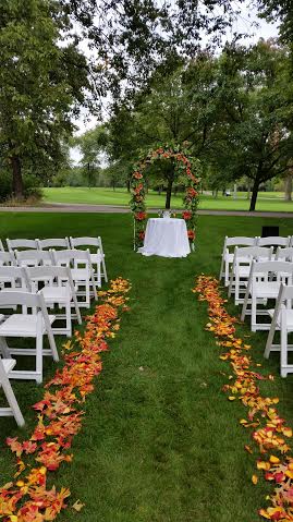 outdoor wedding ceremony with chairs and and alter set up