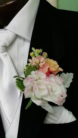 boutonniere pinned to a suit