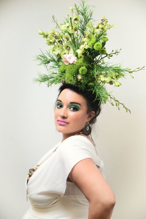 large green floral headpiece on a woman in white