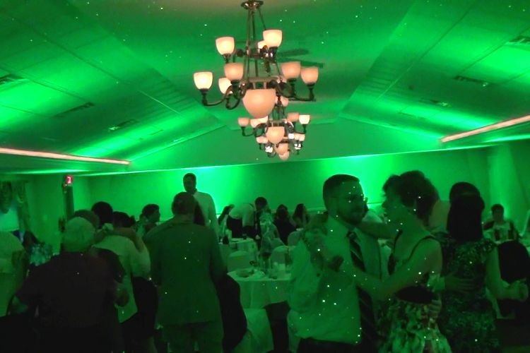 Green uplighting at a wedding