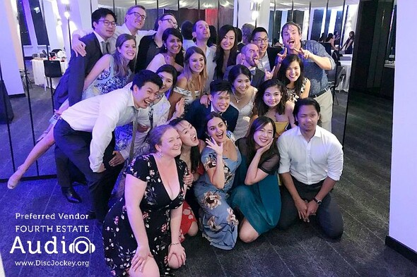 Group of people posing for a photo at a wedding